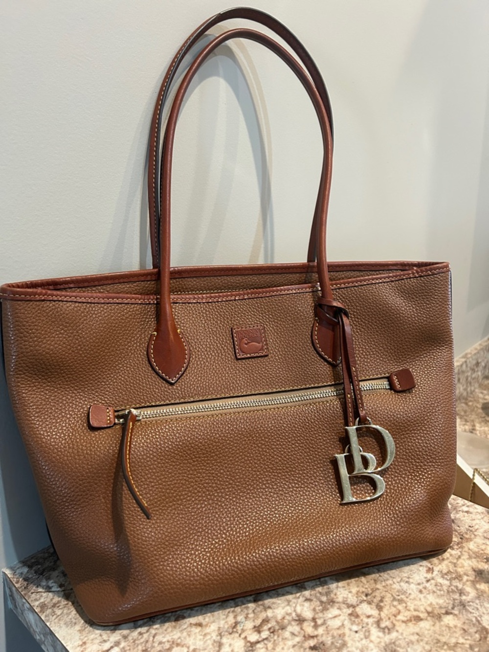 Dooney & Bourke Tan/Brown Leather Tote with DB Charm